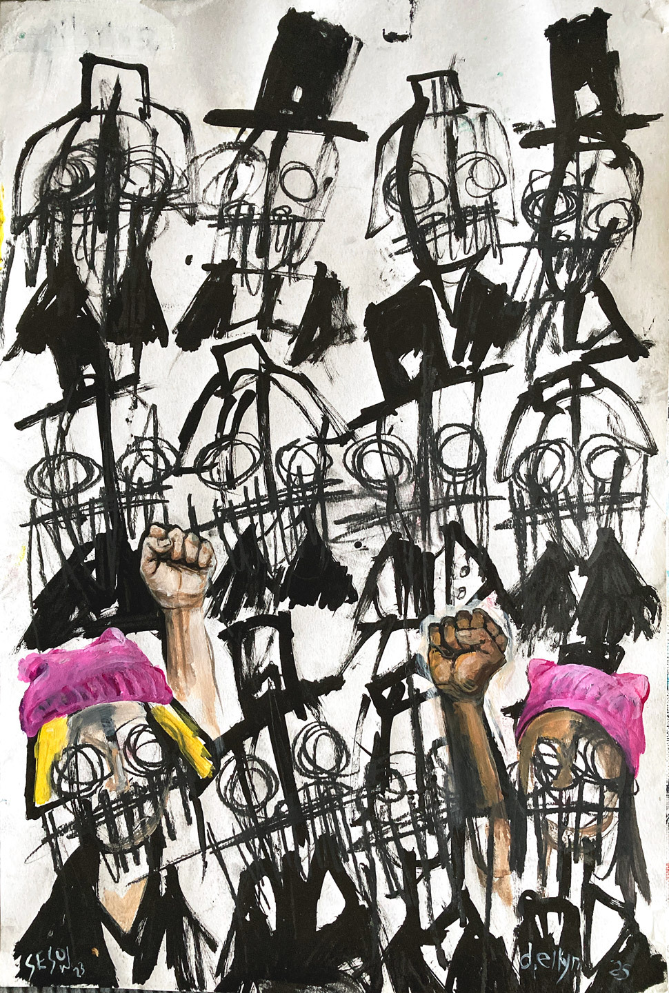 A crowd of faces and two are wearing pink pussy hats with fists raised in protest
